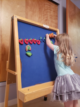 Gennie’s daughter, Tilly, playing with her felt stories Photo Credit © Gennie Gorback